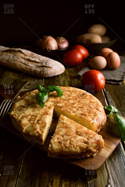 Cooking ingredients around pie on table