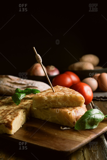 Cooking ingredients around pie on table