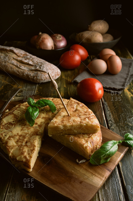 Cooking ingredients around pie on table
