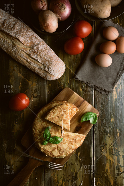 Cooking ingredients around pie on table