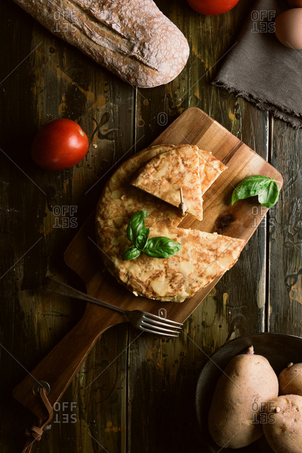 Cooking ingredients around pie on table