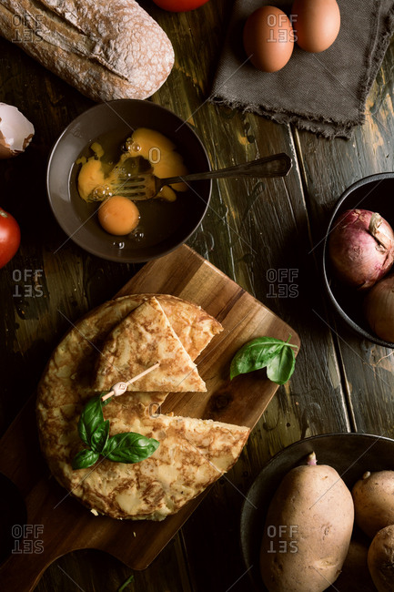 Cooking ingredients around pie on table
