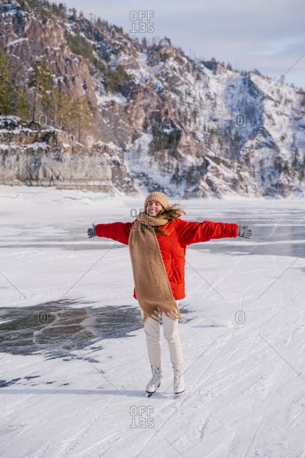 Woman skating on frozen river