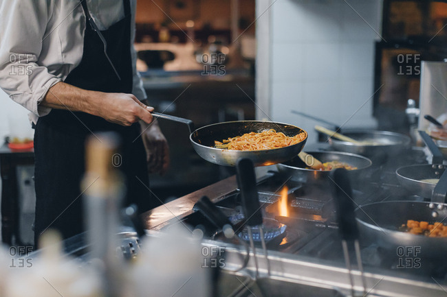 Chef preparing pasta in an Italian restaurant
