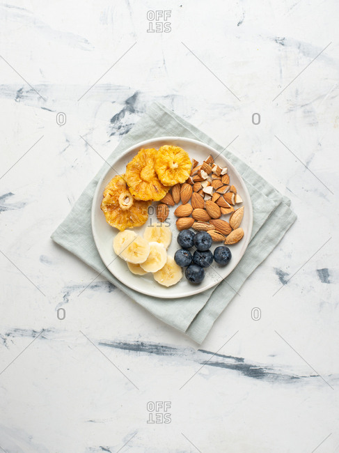 Breakfast plate with fruits, blueberry and almond
