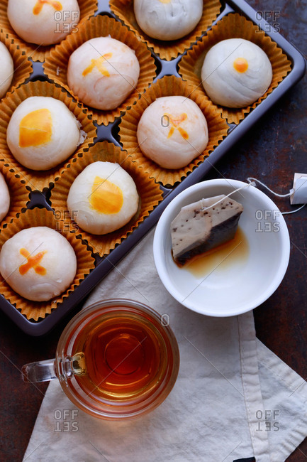 A cup of tea with chinese pastry