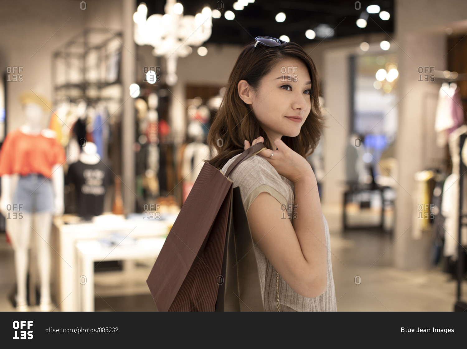 Elegant Chinese woman shopping in shopping mall