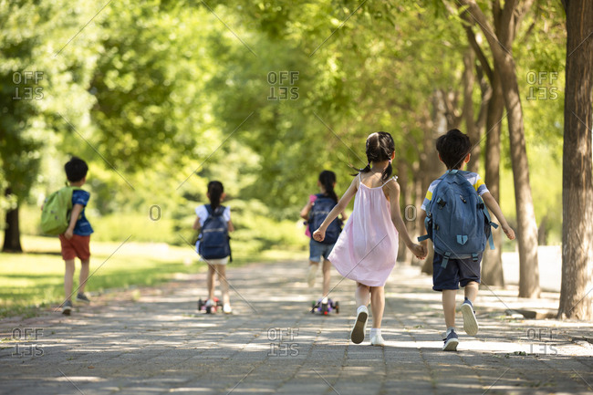 Happy Chinese children going to school