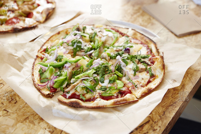 High angle view of pizza served on table at restaurant