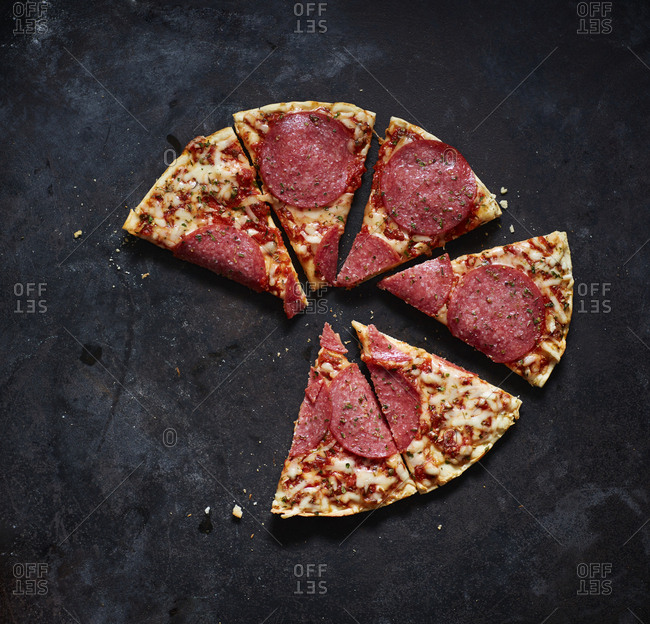 Slices of salami pizza