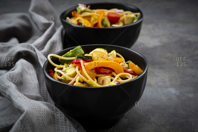 Bowls of spaghetti with grilled vegetables