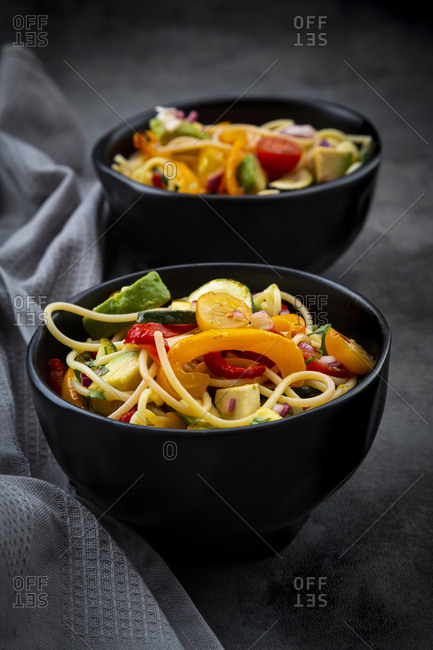 Bowls of spaghetti with grilled vegetables