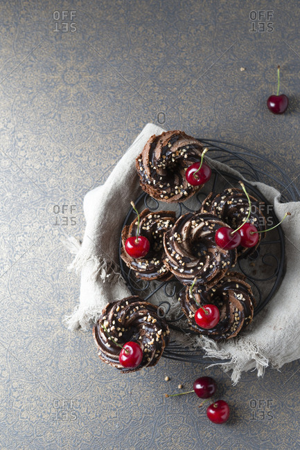 Basket of German minigugelhupf cakes with chocolate- brittle and cherries