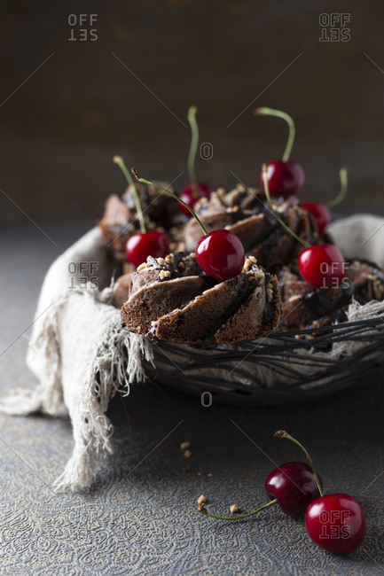 Basket of German minigugelhupf cakes with chocolate- brittle and cherries