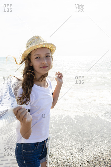 Smiling girl with towel on the beach- Tuscany- Italy