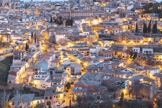 Spain- Province of Toledo- Toledo- Aerial view of illuminated city at dawn