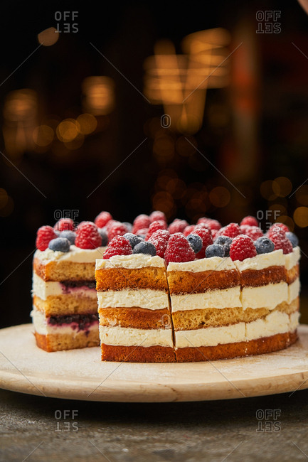 Delicious layered cake with berries on top