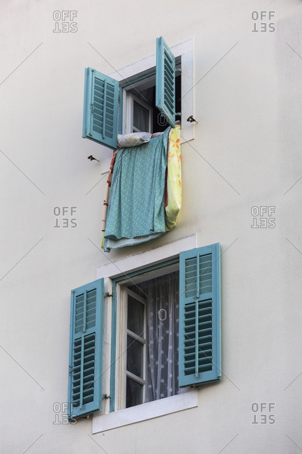 Bed linen is aired on the window sill