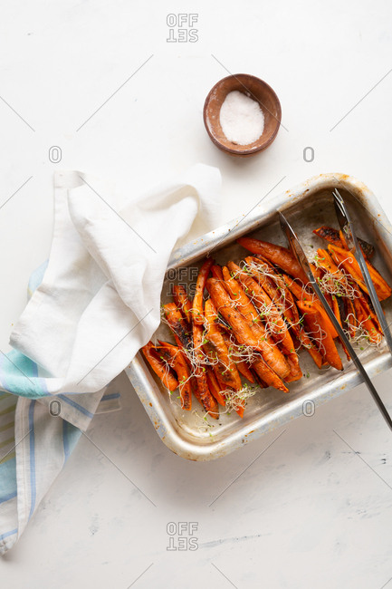 Overhead view of oven baked carrots in baking pan