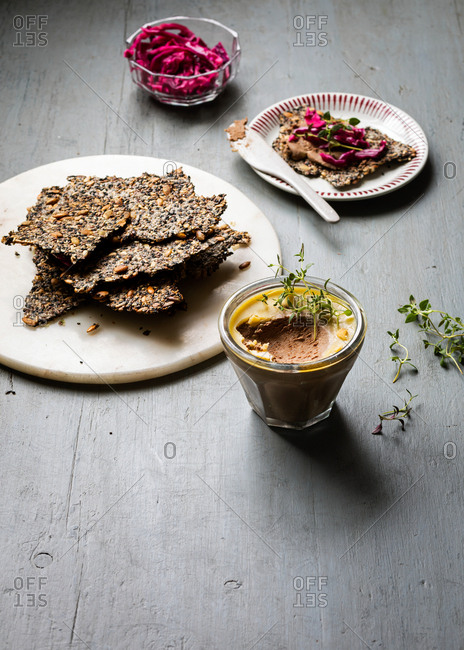 Seed brittle and mousse on gray wooden background