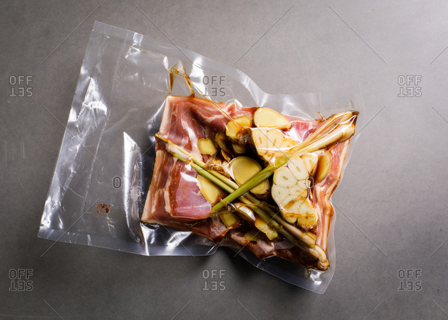 Raw ingredients in a sealed bag on gray surface