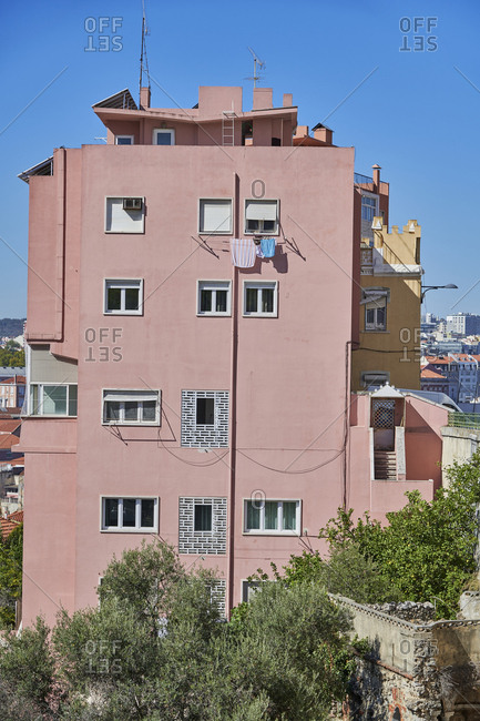 Pink fa�ade of apartment building in Lisbon, Portugal
