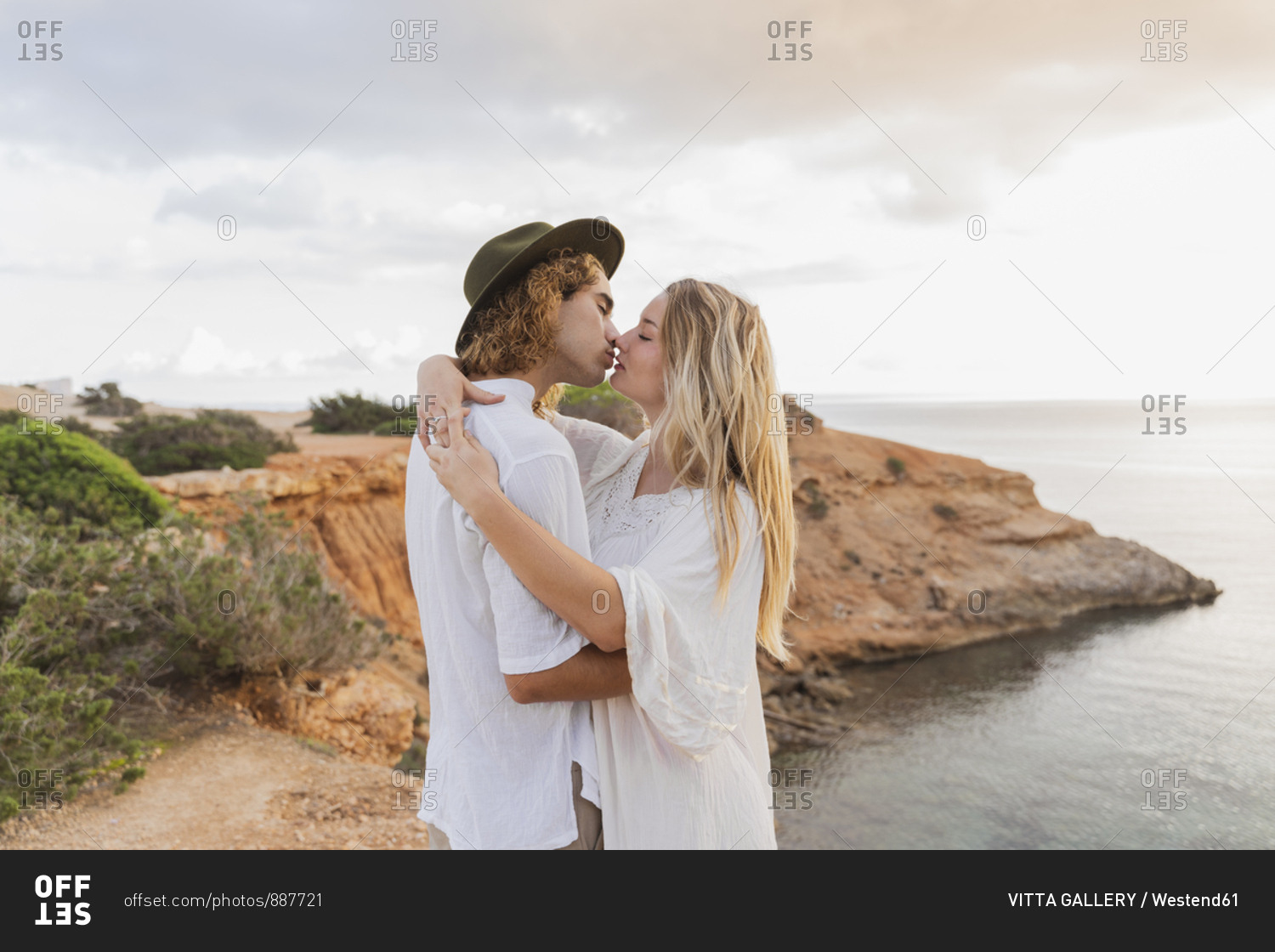 Kissing young couple in love in front of the sea- Ibiza- Balearic Islands- Spain