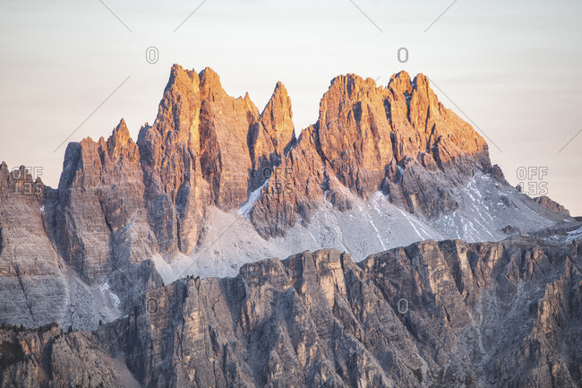 Scenic view of mountain peaks in Italy against sky during sunset- Italy