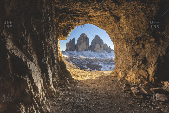 Scenic view of Tre Cime di Lavaredo seen through cave- Italy