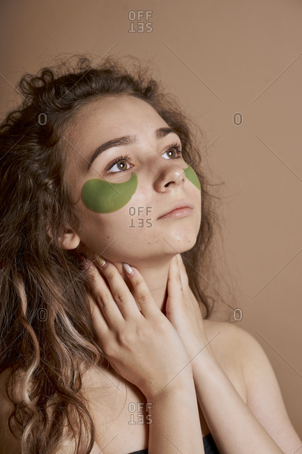 Woman young and cute using beauty mask under eye