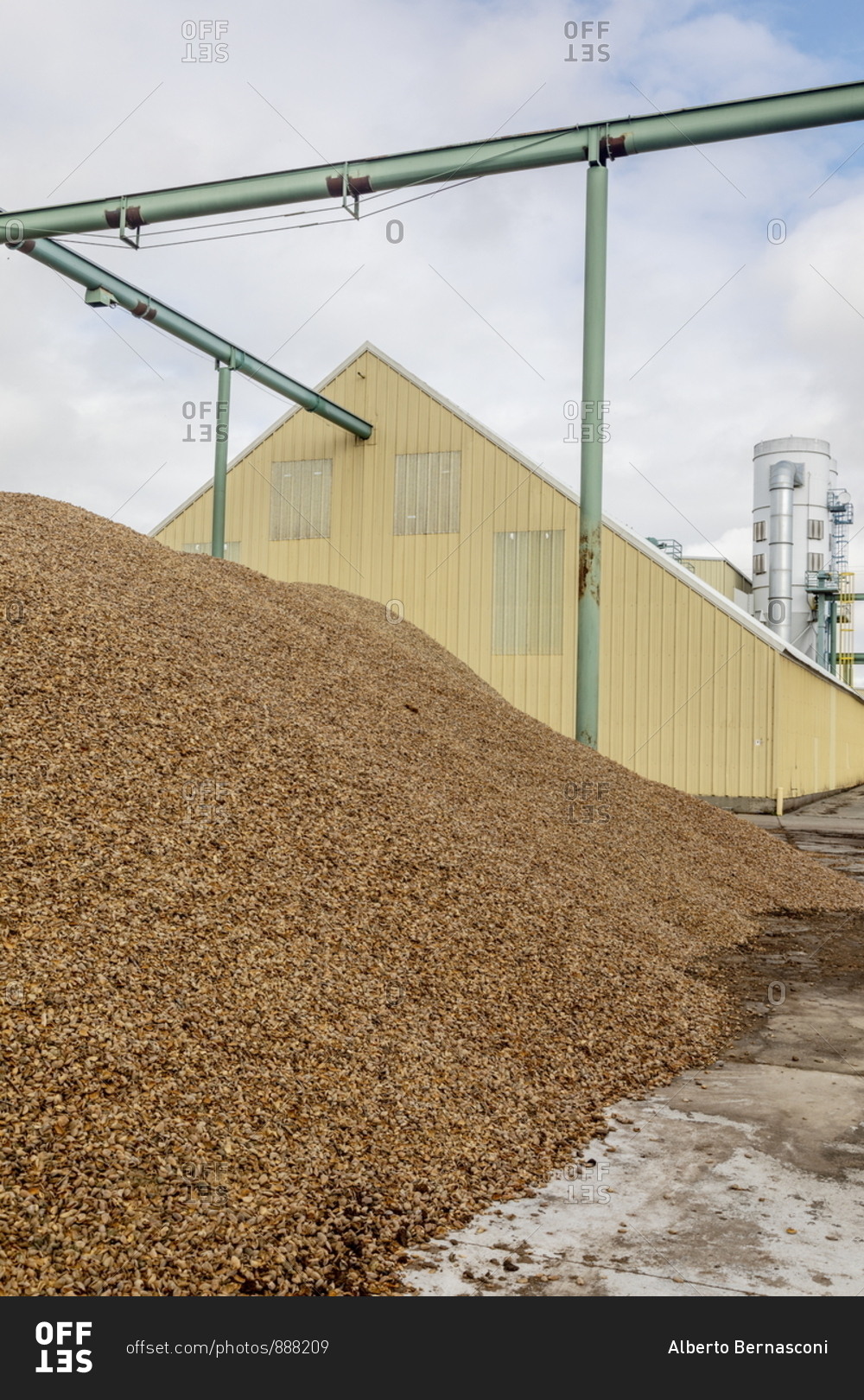 Mounds of almond shells to be recycled and reused in an almond factory