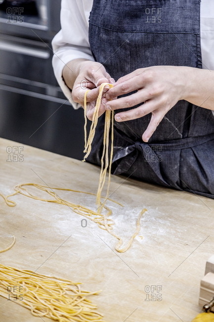 Chef preparing noodles in an Italian restaurant