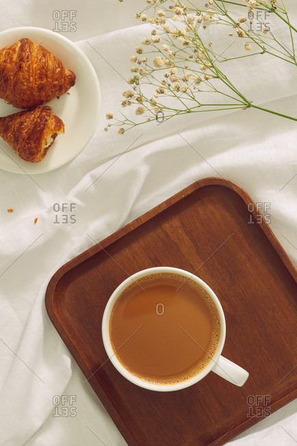 Top view of a cup of fresh coffee and breakfast