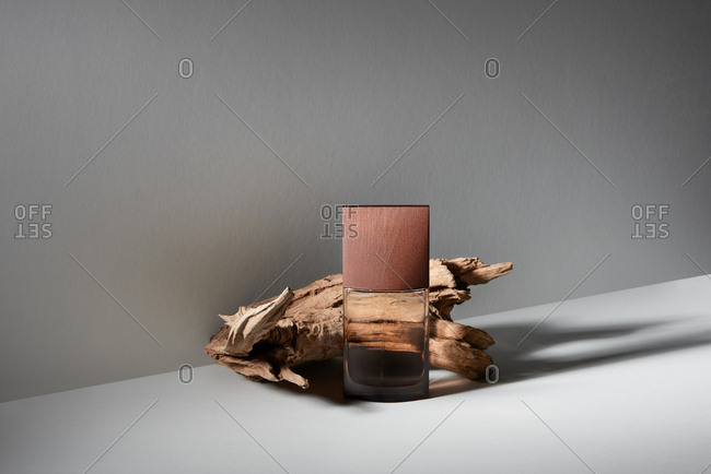 Fragrance perfume bottle mockup on wooden background