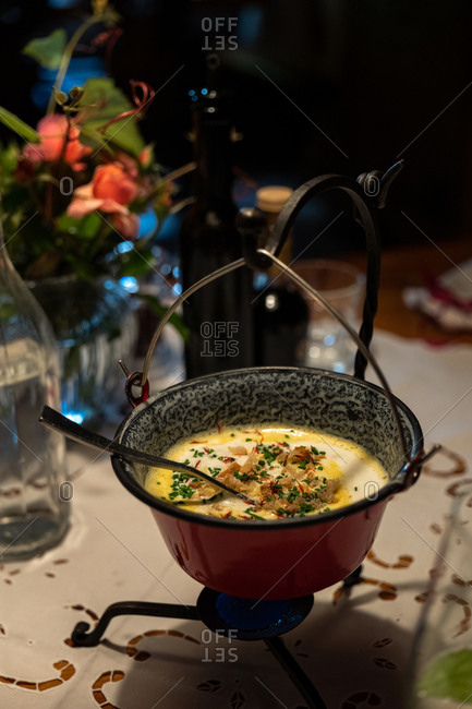Fondue appetizer on a restaurant table, Meran, South Tyrol, Italy