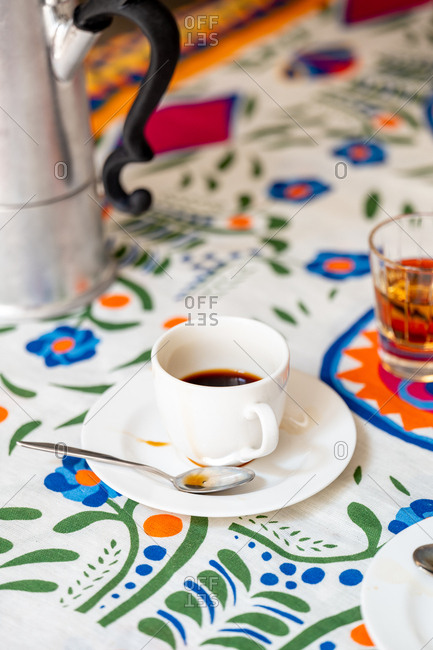 Coffee amaro beside a moka pot