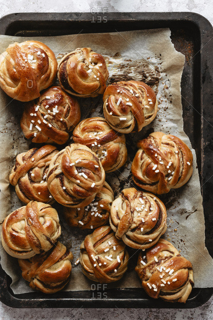 Bunch of cinnamon knots on baking tray