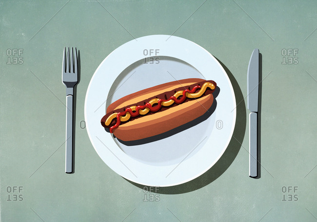 Hot dog with ketchup and mustard on plate