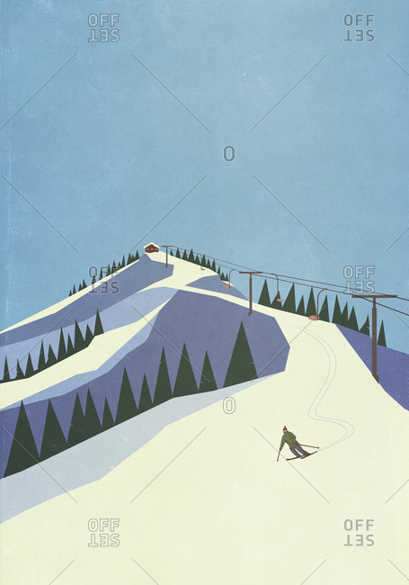 Skier descending snowy mountain slope