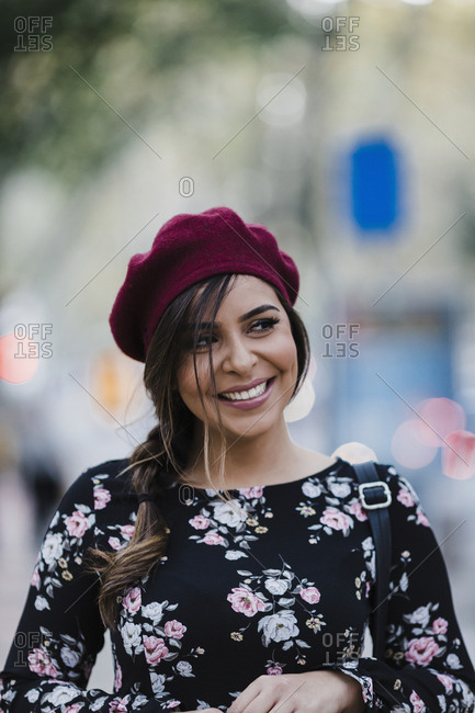 Portrait happy young woman in beret