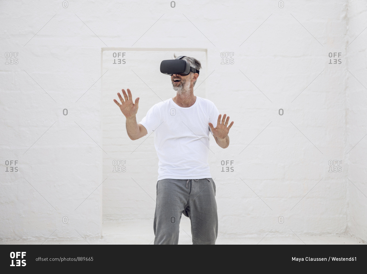 Mature man discovering empty space with VR goggles