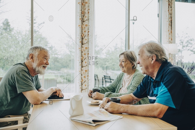 Home Dining With Friends Stock Photos Offset Home Dining With Friends Stock Photos, Nursing Home Dining Tables