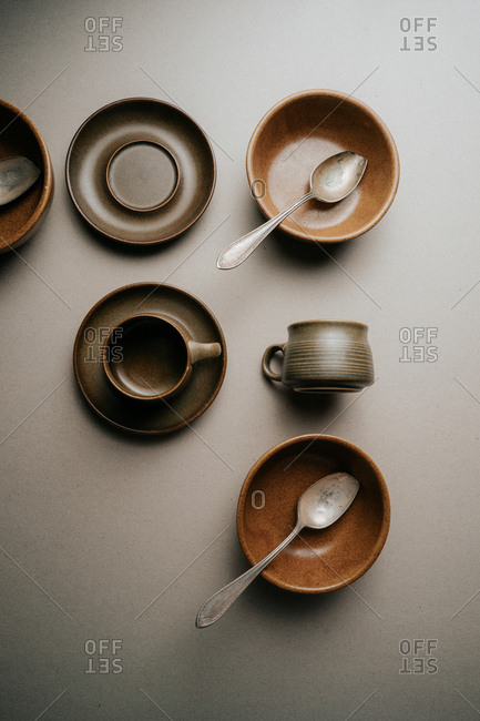 Brown mugs, saucers and bowls
