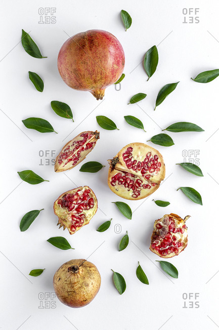 Fresh seasonal pomegranate from above on white background. Healthy food Detox. Flat lay