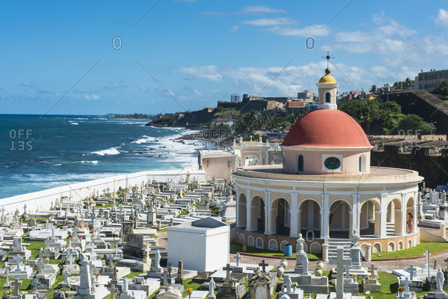 View of Santa Mar√åa Magdalena de Pazzis Cemetery by sea against blue sky- Puerto Rico- Caribbean