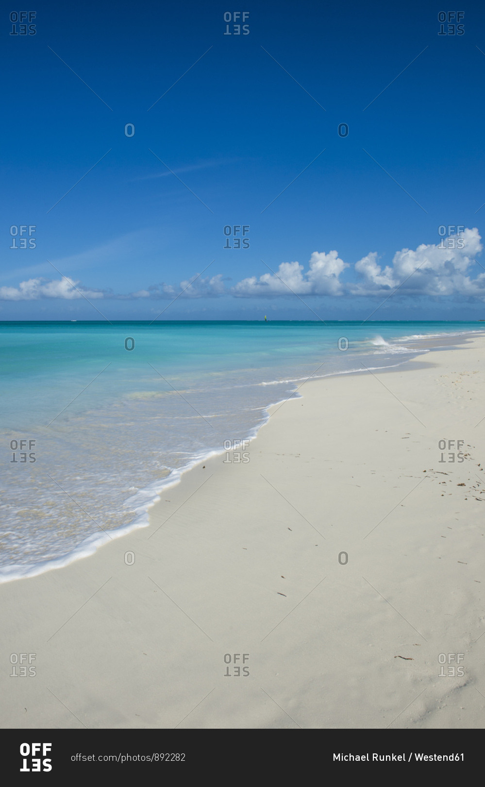 Scenic view of Grace Bay beach against blue sky- Providenciales- Turks And Caicos Islands
