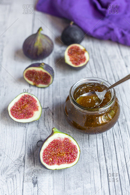 Sliced figs and jar of homemade fig jam
