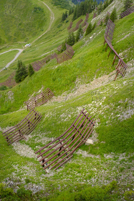 Austria- Vorarlberg- Mittelberg- Mountain ridge secured with avalanche barricades