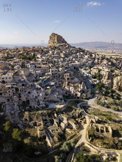 Aerial view of Uchisar castle and buildings against blue sky in Cappadocia- Turkey