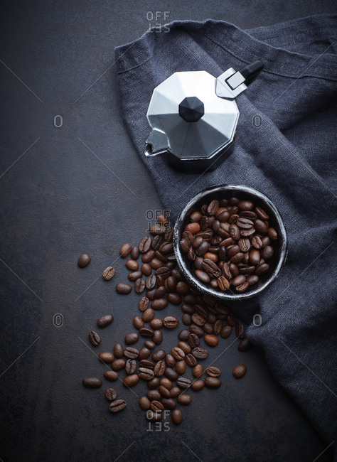 Kettle and bowl of cocoa and coffee beans